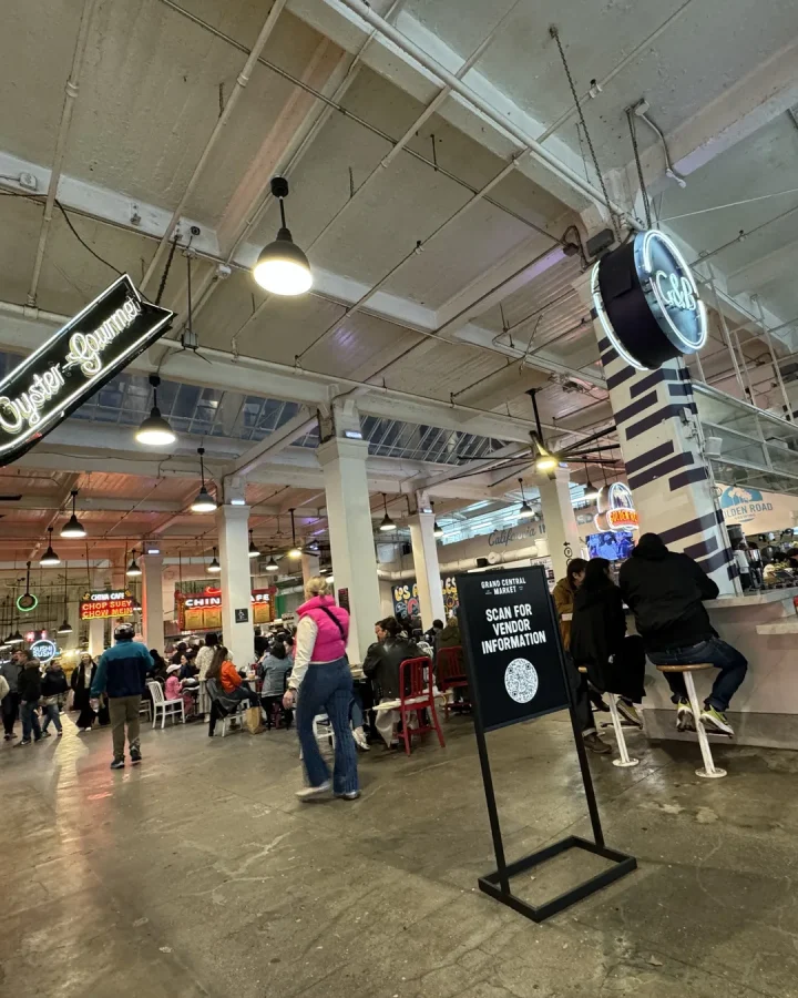 Food counters and illuminated signs inside Grand Central Market in downtown Los Angeles