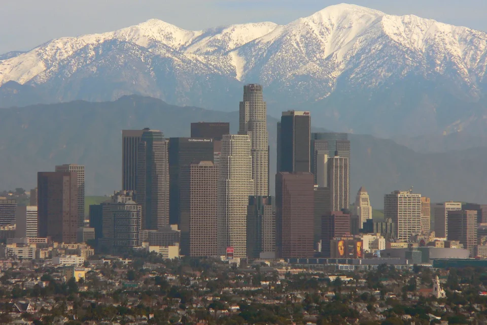 Downtown Los Angeles skyline beneath the San Gabriel Mountains